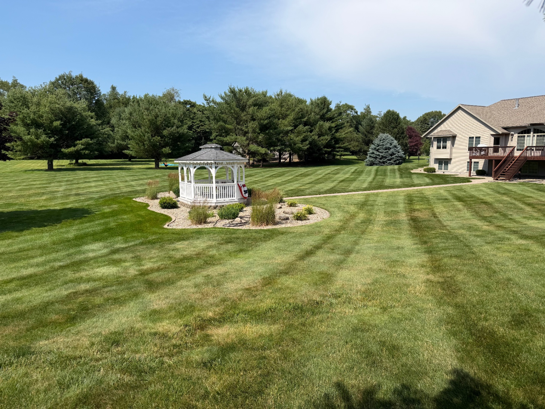 Lawn maintenance in progress at a South Bend area property