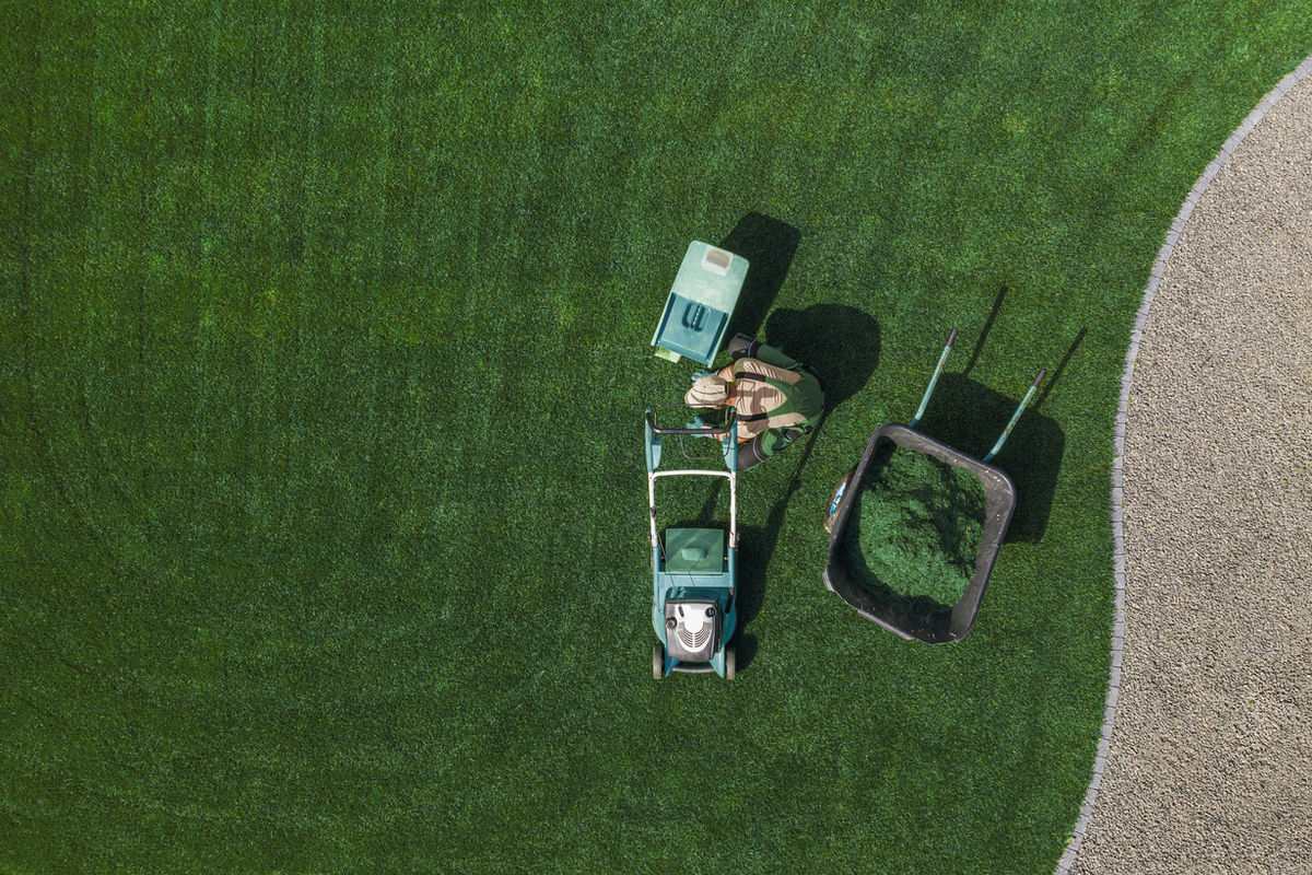 Lawn maintenance in progress at a South Bend area property
